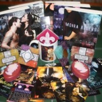 Auction: Moira Rogers’ Prize Pack including a year’s worth of ARCs! [Books Fighting Cancer]